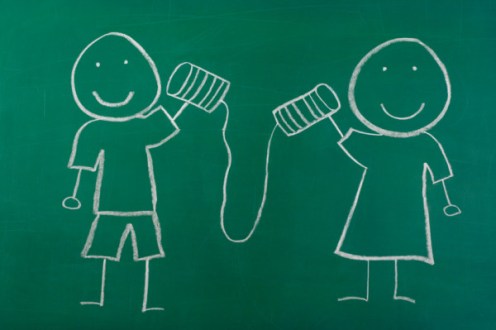 tin can telephone on chalkboard